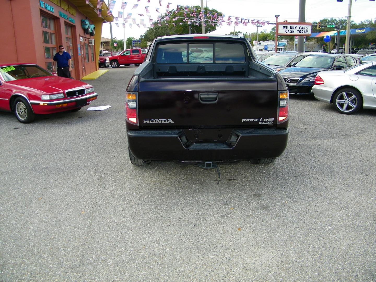 2007 Maroon /Grey Honda Ridgeline RT (2HJYK16267H) with an 3.5L V6 SOHC 24V engine, 5-Speed Automatic Overdrive transmission, located at 4000 Bee Ridge Road, Sarasota, FL, 34233, (941) 926-0300, 27.298664, -82.489151 - Photo#4